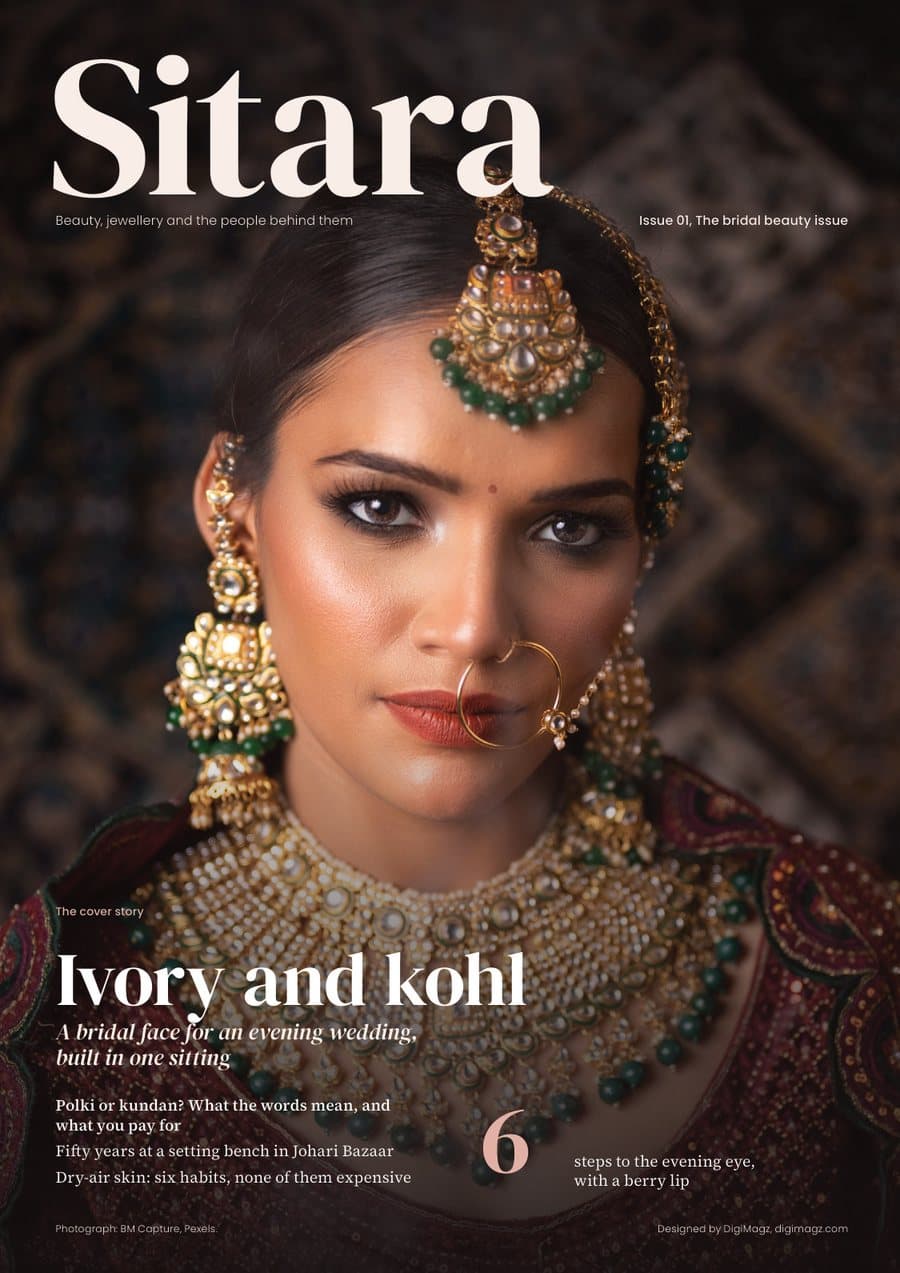 Sitara cover: a bride in a kundan maang tikka and nath, close up against a dark patterned ground, lead line Ivory and kohl